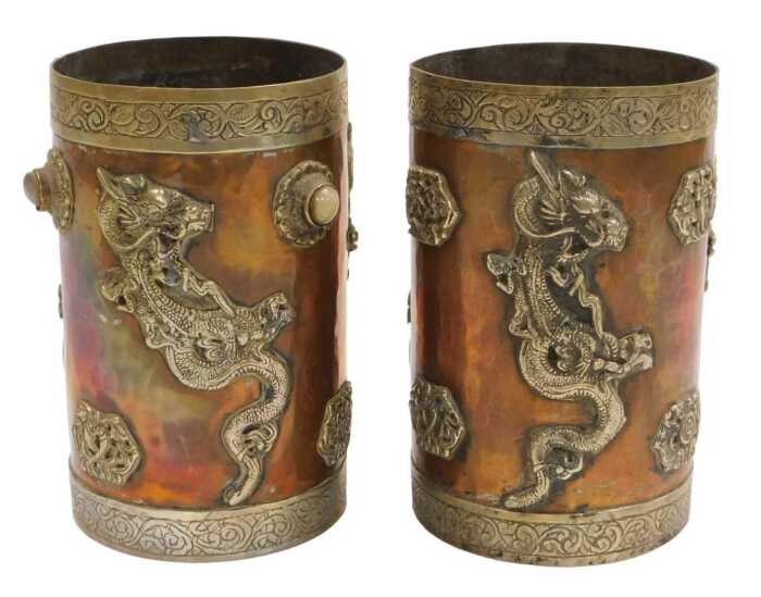 Two early 20thC Oriental copper vessels, of cylindrical form, applied in white metal with...