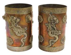 Two early 20thC Oriental copper vessels, of cylindrical form, applied in white metal with...