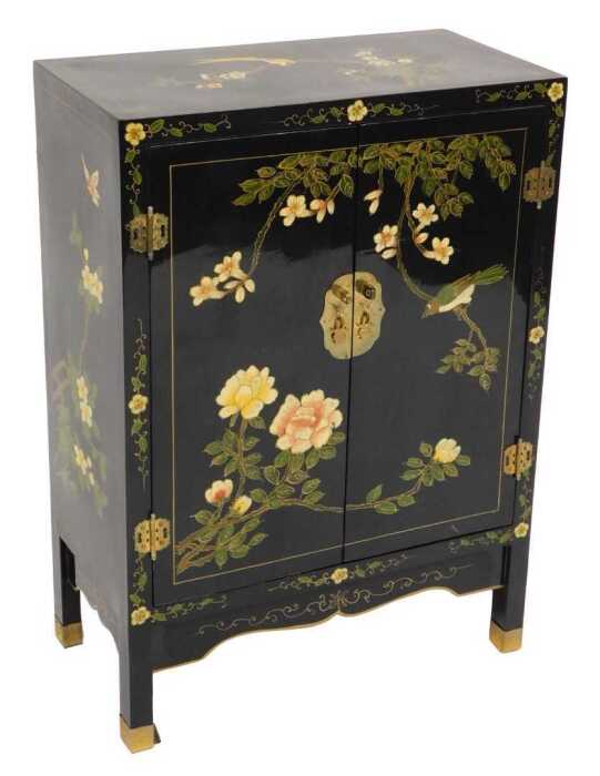 A Chinese black lacquer cabinet, of rectangular section, painted with birds, trees in blossom,...