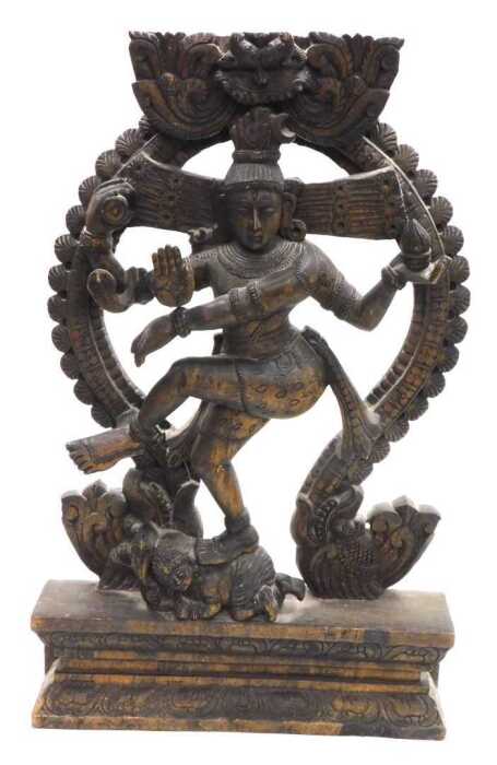 A 20thC Nataraja carved wooden sculpture of Lord Shiva, balanced on a dwarf Apasmara holding a...
