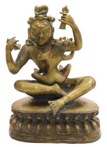 A 19thC Tibetan bronze figure of Mahasiddha Ghantapa and his consort, modelled in embrace,...