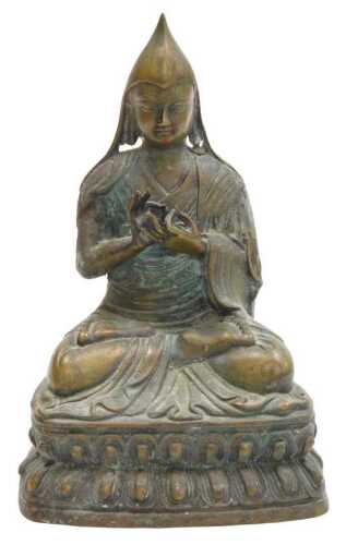 A 19thC Tibetan bronze figure of a Lama Tsongkapa, modelled seated in a lotus flower position,...