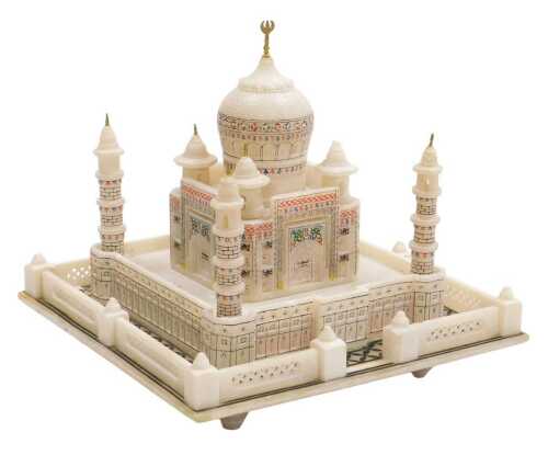 An Indian alabaster illuminated model of the Taj Mahal, 8.5cm high, 20.5cm wide.