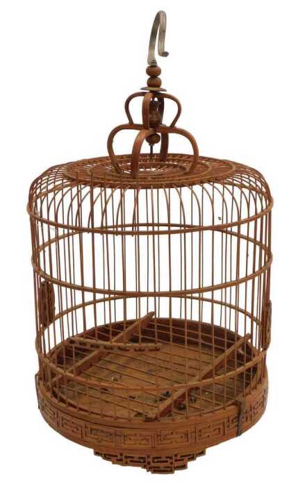 A Chinese bamboo bird cage, of cylindrical form, with a crown top, raised on three tapering...