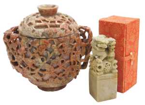 A 20thC Chinese soapstone pot and cover, of twin handled form, carved in relief with vines, 17cm...