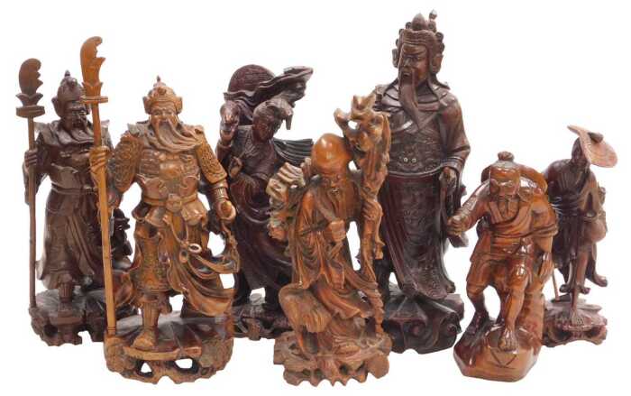 A group of 19thC and later Chinese hardwood figures, including Guanyin, Guan Yu, Shou Lao, and...