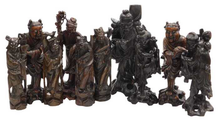 A group of late 19th and later Chinese hardwood figures, chiefly of emperors or deities, largest...