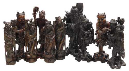 A group of late 19th and later Chinese hardwood figures, chiefly of emperors or deities, largest...