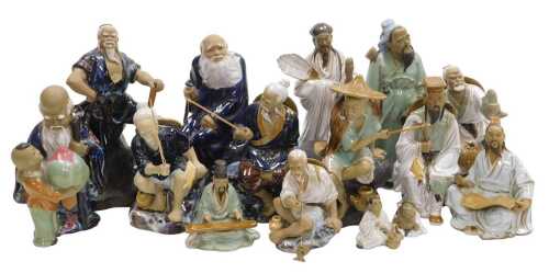 A group of 20thC Chinese Shiwan mudman figures, including fishermen, a deity with a child,...