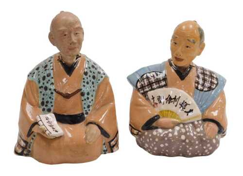 A pair of 20thC Japanese pottery nodding hakata dolls.