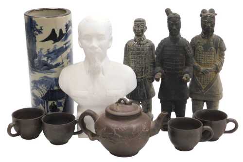 A Vietnamese plaster bust of Ho Chi Minh, a blue and white pottery cylindrical vase decorated...