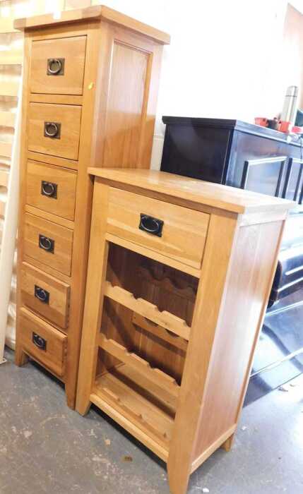 An oak tall chest of drawers, with six drawers, raised on square tapering legs, 150cm high,...
