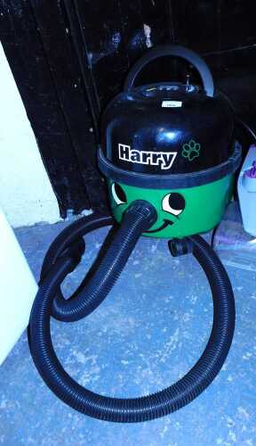 A Henry Numatic International vacuum cleaner, model HHR200-11, lacking hoover head.