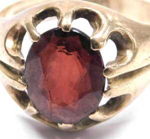 A 9ct gold and single red stone ring, claw set, size P&frac12;, 4.6g. - 2