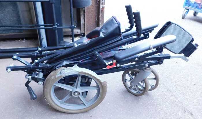 A folding wheelchair.