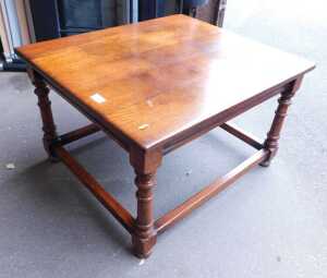 An oak occasional table, the rectangular top raised on turned legs, united by stretchers, 44cm...