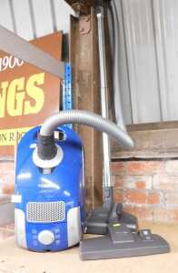 A Miele S4212+ vacuum cleaner, with attachments.
