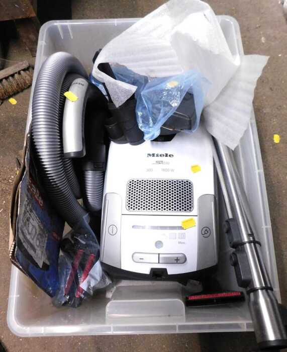 A Miele S4510 vacuum cleaner, with attachments.