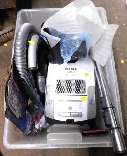 A Miele S4510 vacuum cleaner, with attachments.