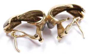 A pair of 9ct two colour gold half hoop earrings, in a crossover design, 4.7g. - 2