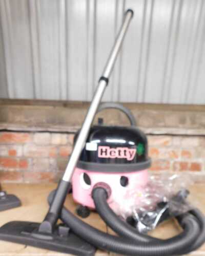 A Hetty vacuum cleaner, with attachments.