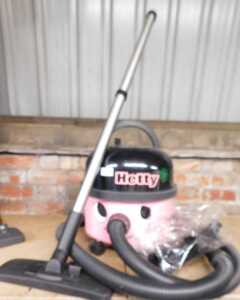 A Hetty vacuum cleaner, with attachments.