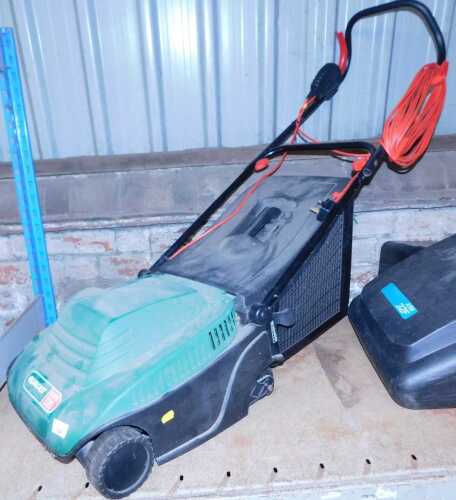 A Qualcast Eclipse 320 electric lawn mower.