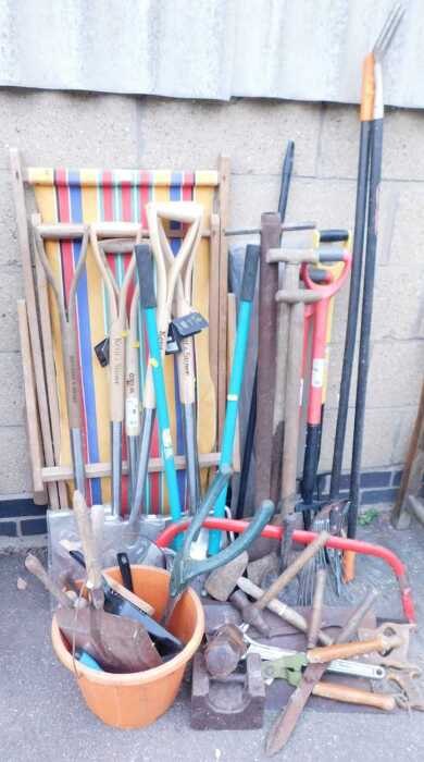 Gardening tools, to include a saw, rake, various shears, spade, and a multicoloured wooden and...