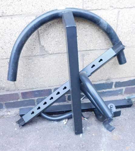 A section of black metal bike racking.