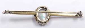 An opal and cz bar brooch, the cabochon opal in a surround of brilliant cut czs, in yellow metal,... - 3