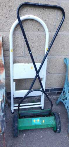 A push mower, PPM35, together with a white enamelled two-step step ladder.