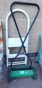 A push mower, PPM35, together with a white enamelled two-step step ladder.