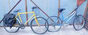 Two bicycles, comprising a yellow painted Apollo all purpose bicycle, and a blue painted Mayfair...