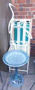 Green and white striped deckchairs, together with a birdbath, garden side table and shelves,...