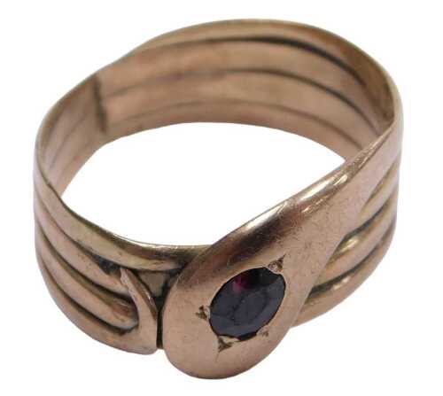 A 9ct rose gold and red stone set serpent ring, size U, 4.5g.