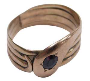 A 9ct rose gold and red stone set serpent ring, size U, 4.5g.