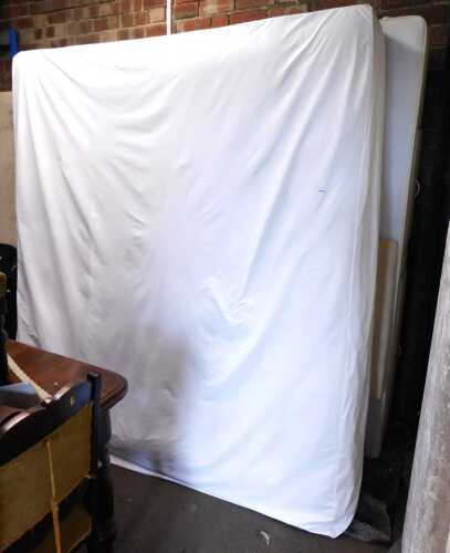 A kingsize bed, comprising mattress and divan bed base.