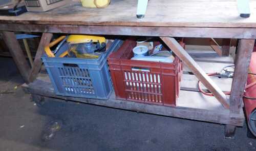 A wooden two tier work bench, 75cm high, 153cm wide, 68cm deep, together with a workman's visor,...