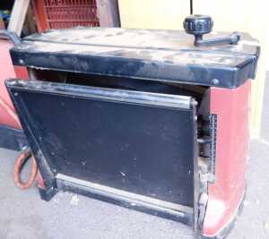 A portable bench wood thickness planer.
