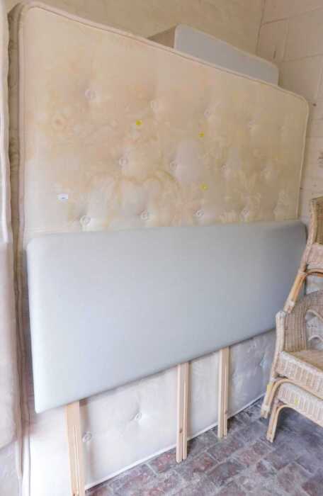 A super king bed, comprising a pale grey upholstered headboard, mattress and bed base. (mattress...