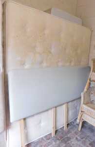 A super king bed, comprising a pale grey upholstered headboard, mattress and bed base. (mattress...