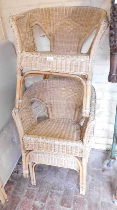 Three wicker tub chairs.
