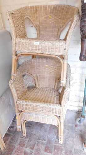 Three wicker tub chairs.
