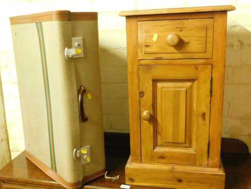 A pine bedside cupboard, with a single drawer above a panelled cupboard, 70cm high, together...