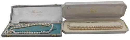 A string of graduated cultured pearls, on a lobster claw clasp, stamped 375, and two strands of...