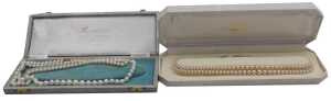 A string of graduated cultured pearls, on a lobster claw clasp, stamped 375, and two strands of...
