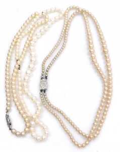 A string of graduated cultured pearls, on a lobster claw clasp, stamped 375, and two strands of... - 2