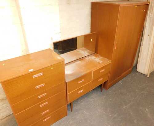 A mid century bedroom suite, comprising a double wardrobe with sliding doors, a mirror back...