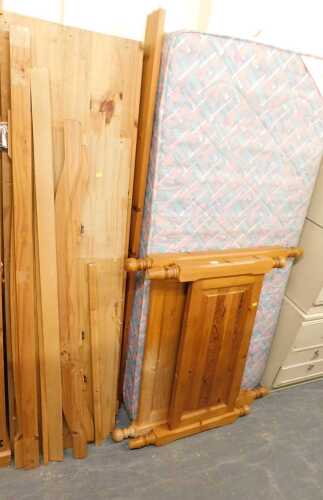 A pine single bed, comprising headboard, footboard, base, and a Cumfilux Sheraton mattress.