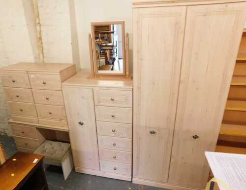 An Alstons Furniture bedroom suite, comprising a double wardrobe, a pair of three drawer bedside...